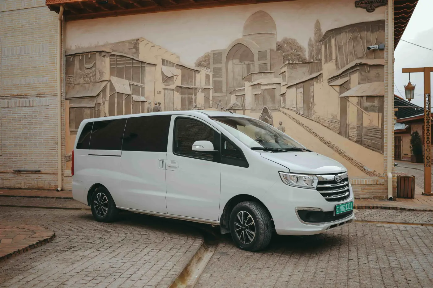 JAC JS6 premium crossover side profile view in motion on scenic highway modern design silver color