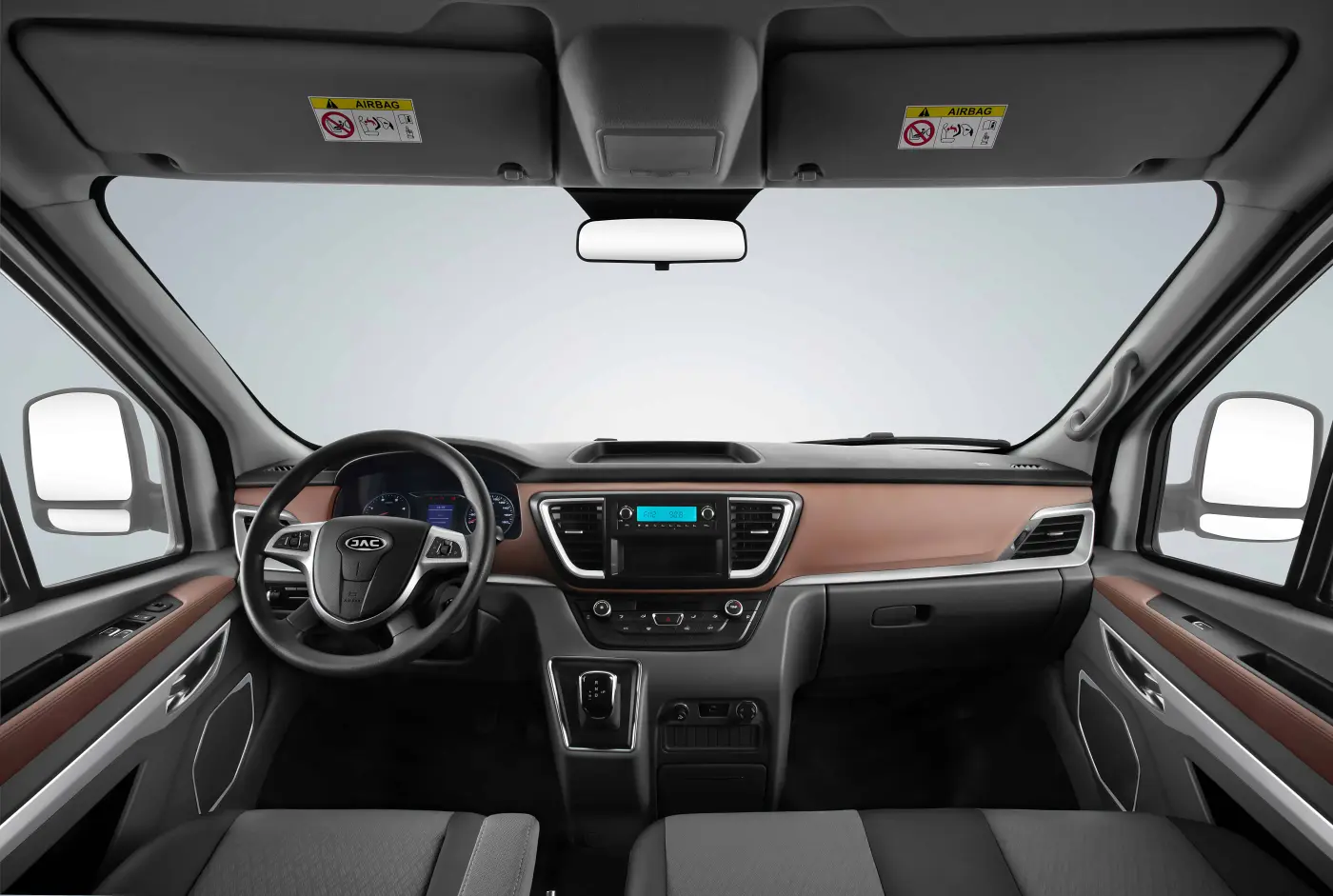 JAC JS6 premium crossover side profile view in motion on scenic highway modern design silver color