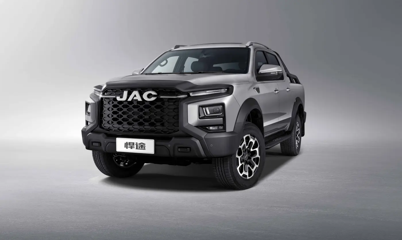 JAC JS6 premium crossover side profile view in motion on scenic highway modern design silver color