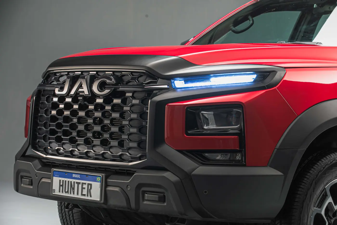 JAC JS6 rear view with LED taillights at dusk city background cinematic lighting modern design