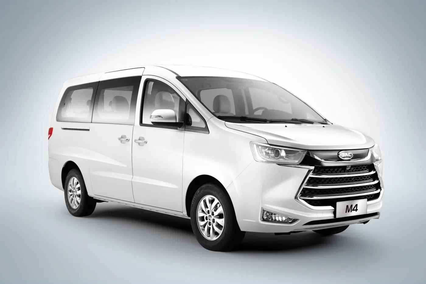 JAC JS6 premium crossover side profile view in motion on scenic highway modern design silver color